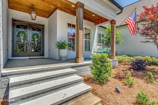102 Silverleaf Dr, Madison, MS 39110 - view of exterior entry with covered porch and french doors