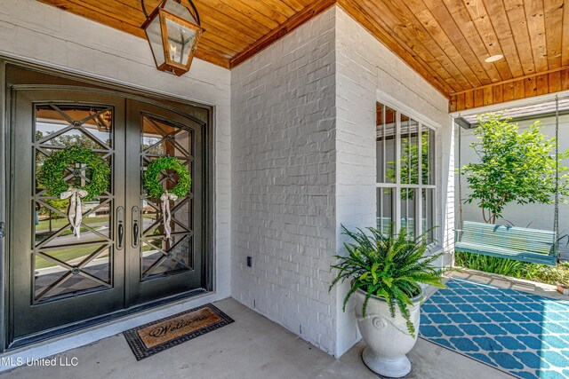 102 Silverleaf Dr, Madison, MS 39110 - view of exterior entry with french doors and a porch