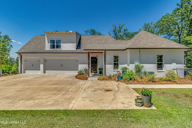 102 Silverleaf Dr, Madison, MS 39110 - view of front of house featuring brick siding, concrete driveway, a garage, roof with shingles, and a front lawn