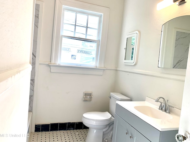 full bathroom featuring vanity, toilet, and independent shower and bath