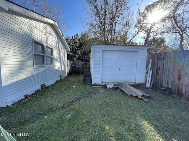 garage featuring a lawn