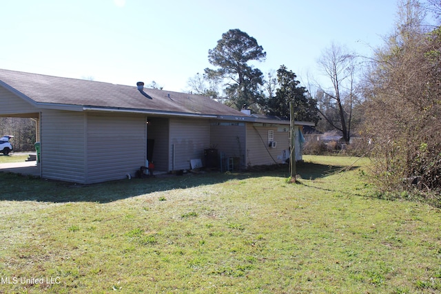 back of property featuring a lawn