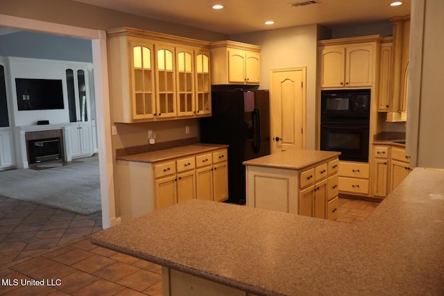 2212 Sampras Blvd, Vancleave, MS 39565 - kitchen with black appliances, recessed lighting, glass insert cabinets, carpet, and tile patterned floors