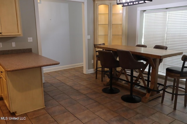 2212 Sampras Blvd, Vancleave, MS 39565 - dining space featuring baseboards and dark tile patterned floors
