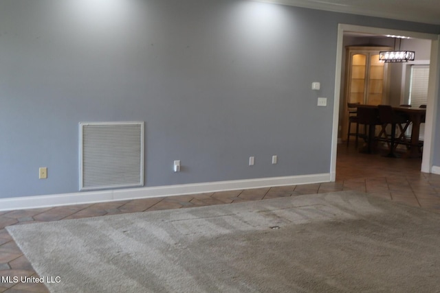 2212 Sampras Blvd, Vancleave, MS 39565 - tiled empty room with a chandelier and baseboards