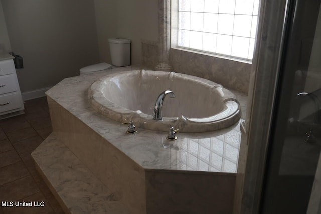 2212 Sampras Blvd, Vancleave, MS 39565 - bathroom with tile patterned flooring and a garden tub