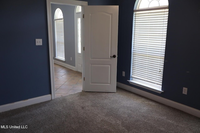 2212 Sampras Blvd, Vancleave, MS 39565 - unfurnished room with carpet floors, tile patterned floors, and healthy amount of natural light