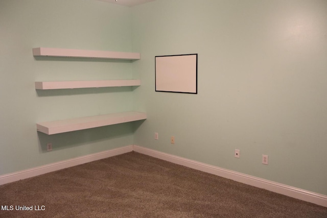 2212 Sampras Blvd, Vancleave, MS 39565 - spare room with dark colored carpet and baseboards