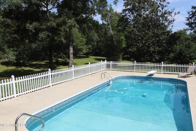 2212 Sampras Blvd, Vancleave, MS 39565 - view of pool featuring a patio area, a diving board, and view of scattered trees
