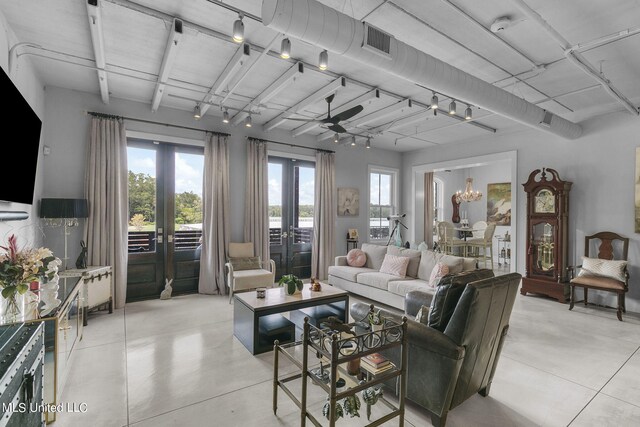 living room featuring french doors and ceiling fan