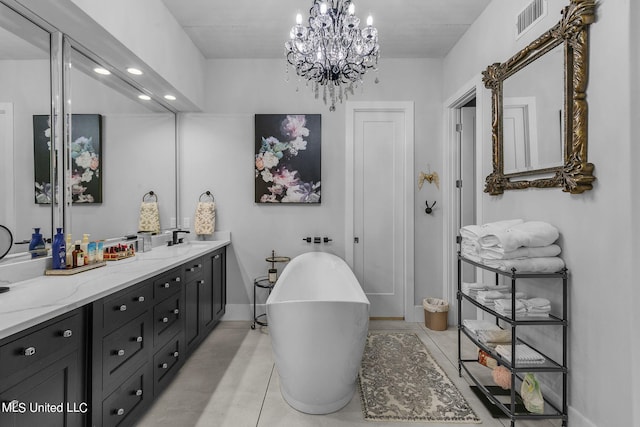 bathroom with vanity, tile patterned floors, and a washtub