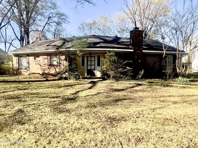 116 E Tate St, Senatobia, MS 38668 - rear view of house featuring a chimney