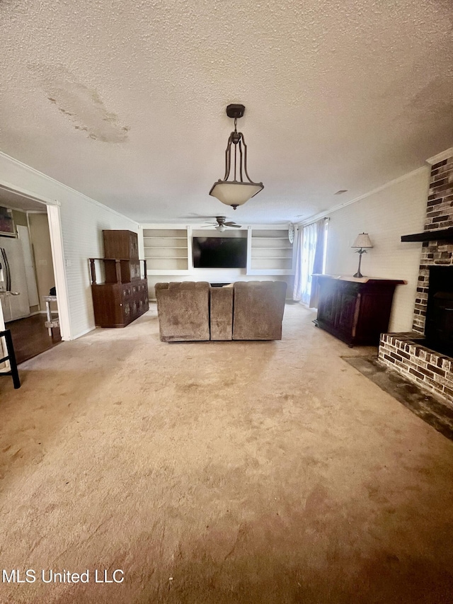 116 E Tate St, Senatobia, MS 38668 - unfurnished living room featuring lofted ceiling, carpet floors, ornamental molding, and a textured ceiling