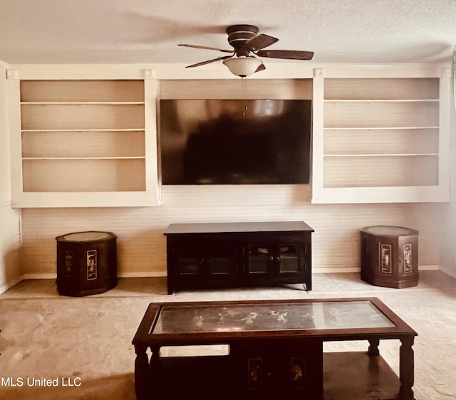 116 E Tate St, Senatobia, MS 38668 - carpeted living area featuring a textured ceiling, ceiling fan, and built in shelves
