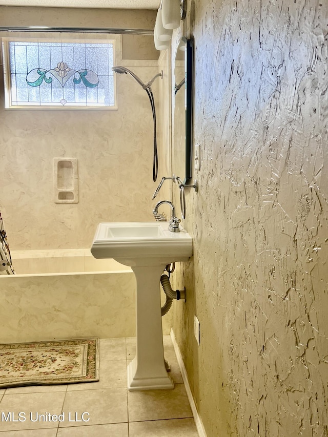 116 E Tate St, Senatobia, MS 38668 - bathroom featuring tile patterned flooring, a bath, and walk in shower