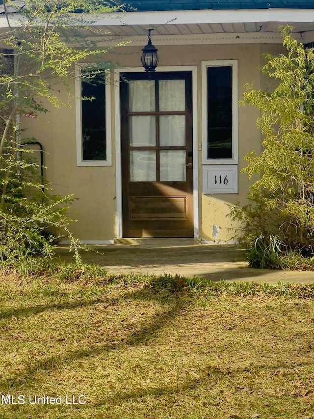 116 E Tate St, Senatobia, MS 38668 - property entrance with stucco siding