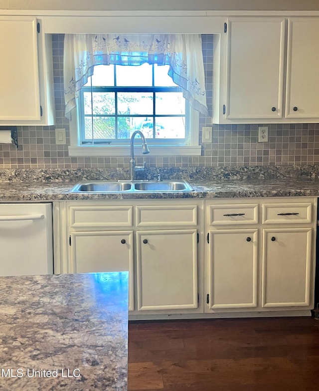 116 E Tate St, Senatobia, MS 38668 - kitchen with dishwasher, white cabinets, a sink, and tasteful backsplash