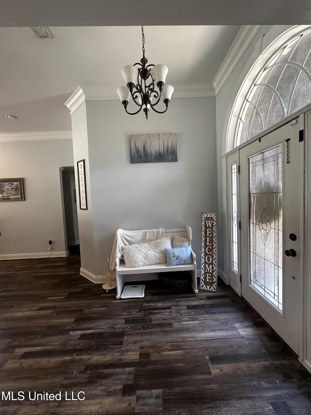 17931 Rayford Shumock Rd, Moss Point, MS 39562 - foyer entrance with ornamental molding, healthy amount of natural light, a chandelier, and dark wood-style flooring