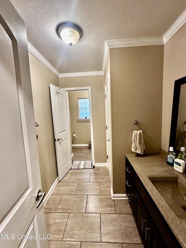 17931 Rayford Shumock Rd, Moss Point, MS 39562 - bathroom with vanity, a textured ceiling, and crown molding