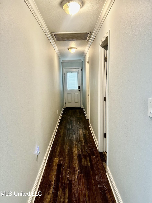 17931 Rayford Shumock Rd, Moss Point, MS 39562 - hallway with wood finished floors, ornamental molding, and attic access