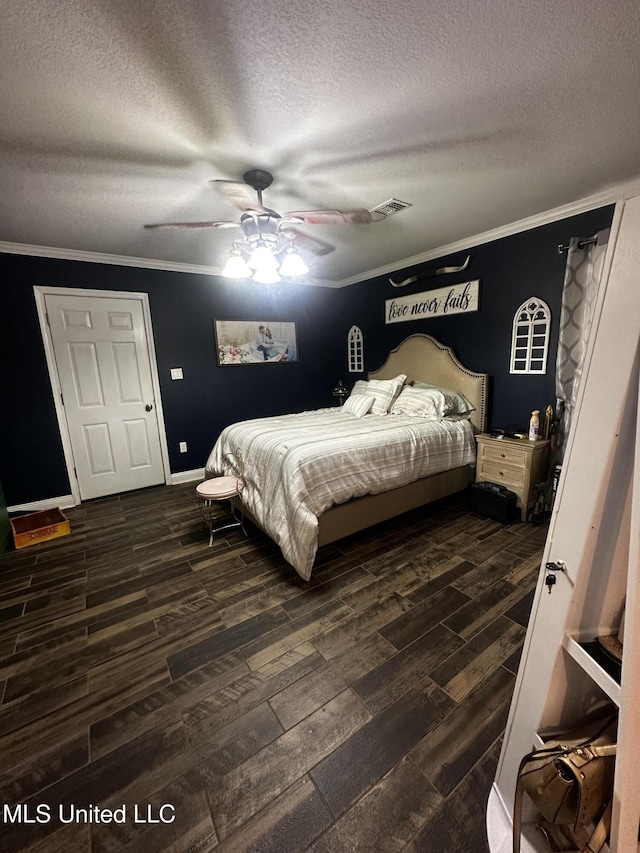 17931 Rayford Shumock Rd, Moss Point, MS 39562 - bedroom featuring crown molding, dark wood-style flooring, a textured ceiling, and ceiling fan