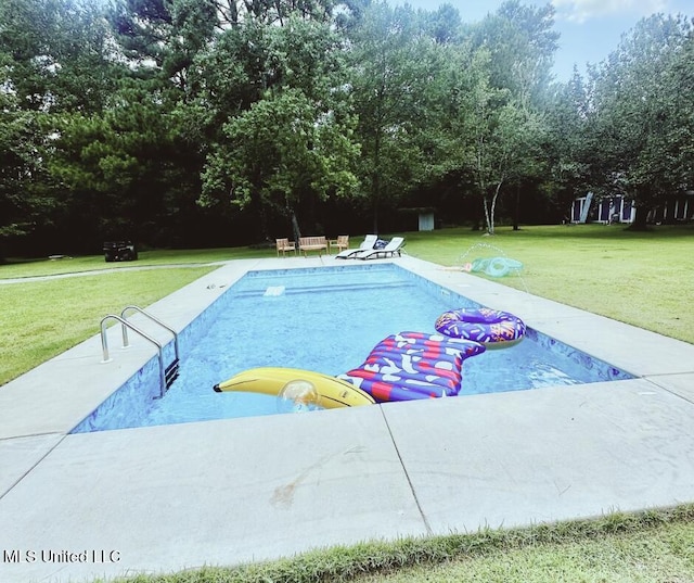 17931 Rayford Shumock Rd, Moss Point, MS 39562 - swimming pool featuring a lawn, view of wooded area, and a patio area