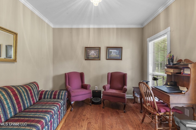 living room with wood finished floors and ornamental molding