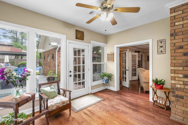 entryway featuring light wood-type flooring, french doors, ceiling fan, and baseboards