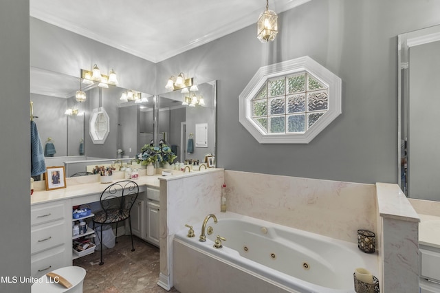 full bathroom featuring vanity, ornamental molding, and a jetted tub