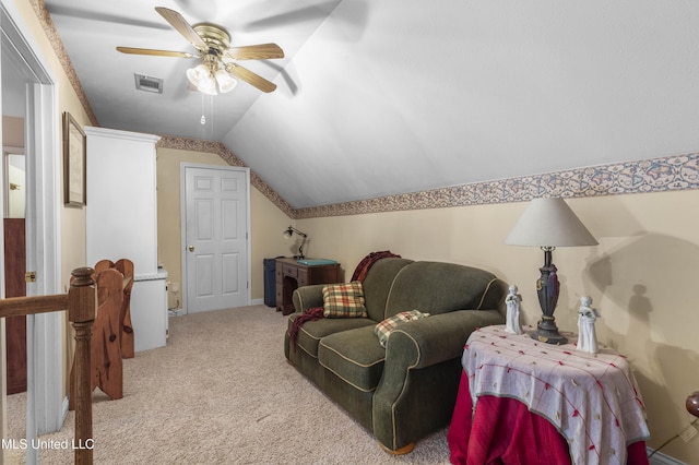 sitting room featuring ceiling fan, lofted ceiling, and carpet floors