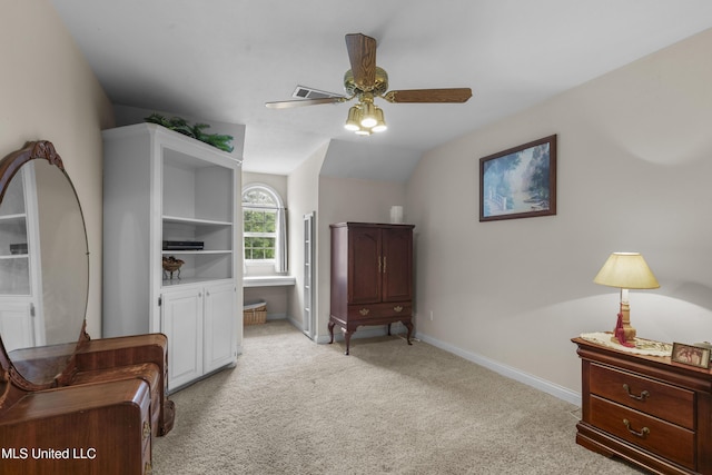 bedroom featuring light colored carpet, baseboards, ceiling fan, and vaulted ceiling