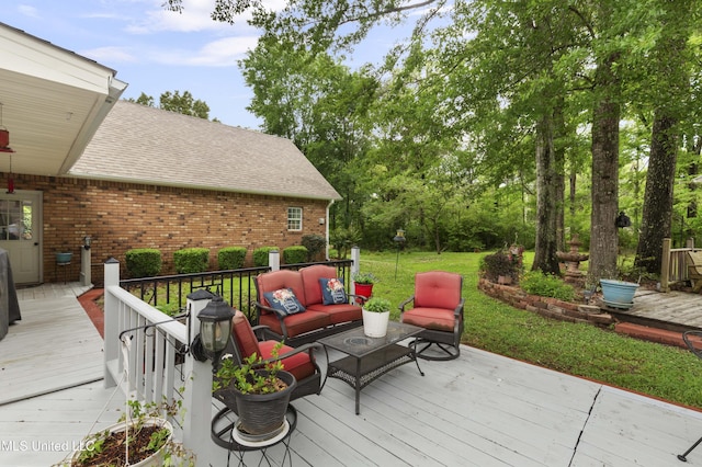 deck featuring an outdoor living space and a lawn