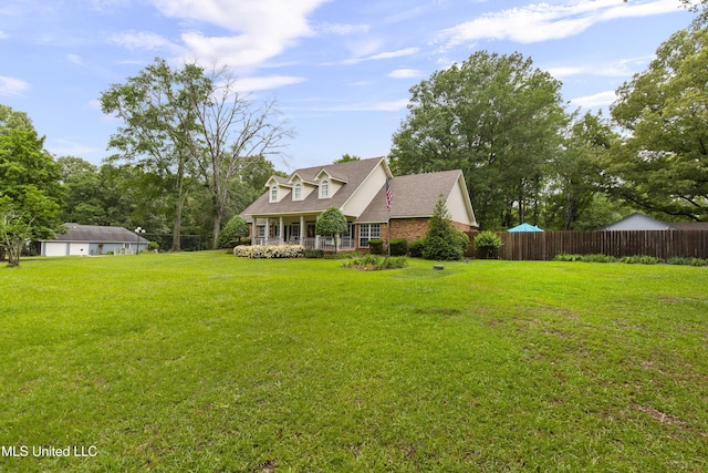 view of front of home with covered porch and a shingled roof