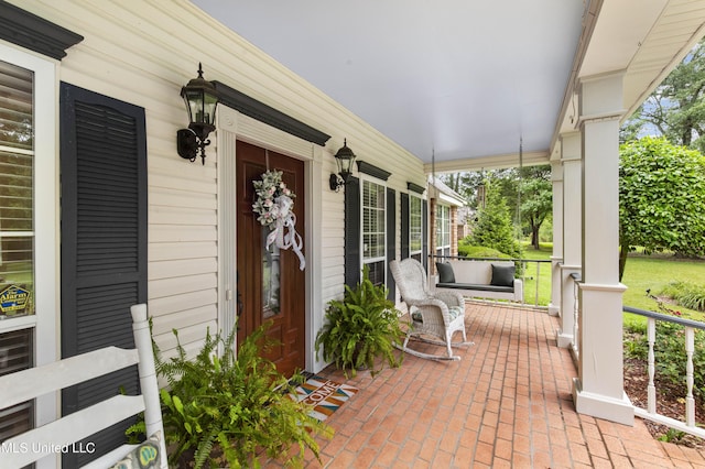 view of exterior entry featuring a porch