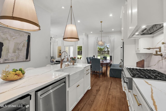 323 Penrose Pl, Madison, MS 39110 - kitchen with custom exhaust hood, stainless steel dishwasher, a sink, gas stovetop, and white cabinets
