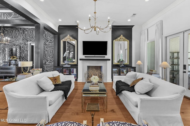 323 Penrose Pl, Madison, MS 39110 - living area featuring a chandelier, ornamental molding, wood finished floors, recessed lighting, and a fireplace