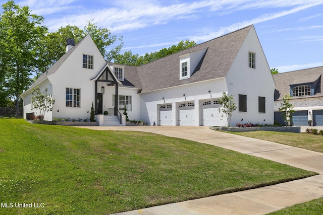 323 Penrose Pl, Madison, MS 39110 - view of front of home featuring concrete driveway, a front yard, a garage, and a chimney