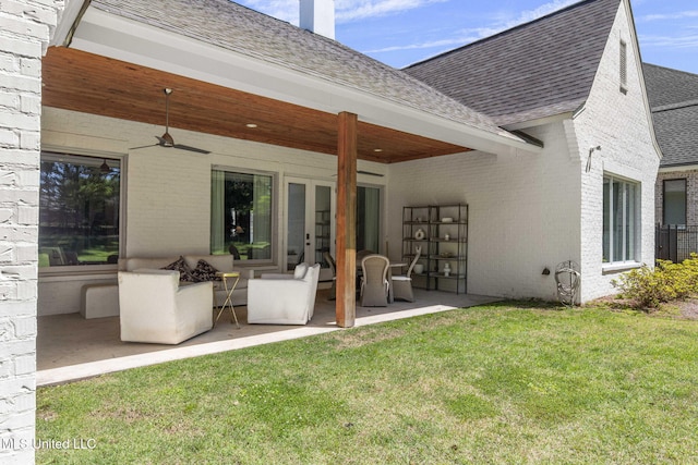 323 Penrose Pl, Madison, MS 39110 - back of house featuring a shingled roof, brick siding, and a yard