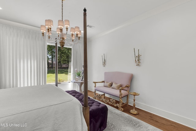 323 Penrose Pl, Madison, MS 39110 - bedroom featuring a chandelier, wood finished floors, and baseboards