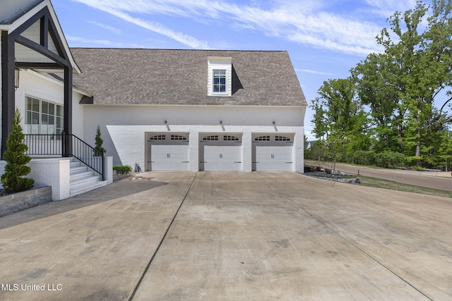 323 Penrose Pl, Madison, MS 39110 - view of property exterior featuring roof with shingles, a garage, and concrete driveway