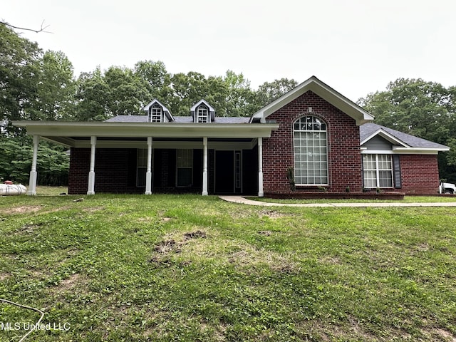 90 Vance Cv, Byhalia, MS 38611 - view of front facade featuring brick siding and a front yard