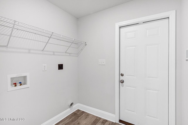 laundry room featuring dark wood-type flooring, electric dryer hookup, and washer hookup