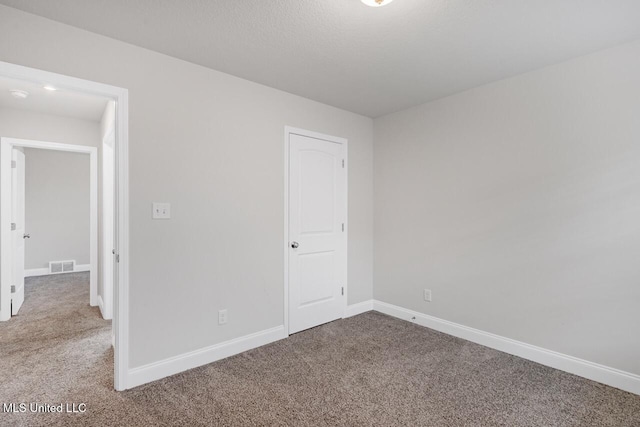 unfurnished bedroom with carpet floors