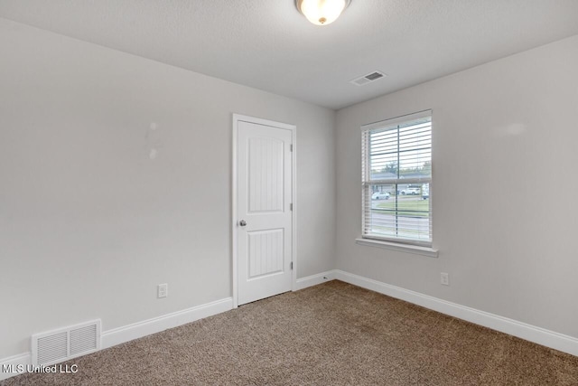 spare room with carpet flooring