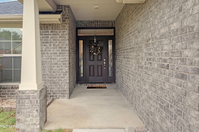 doorway to property with a porch