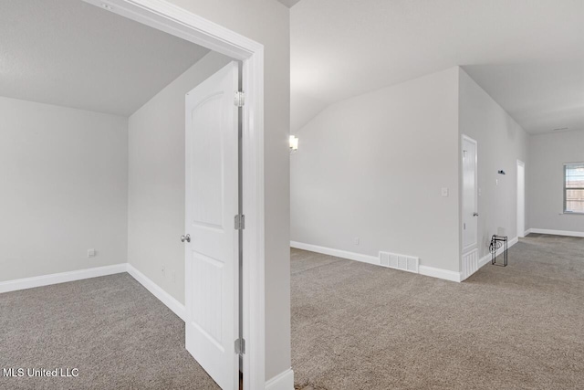 bonus room with carpet and vaulted ceiling