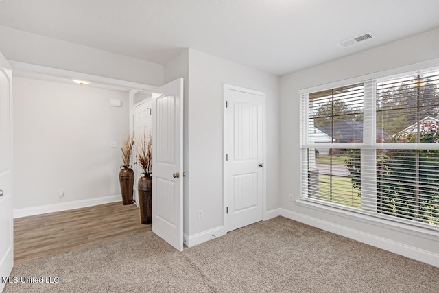 unfurnished bedroom featuring carpet