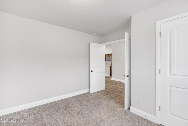 unfurnished bedroom featuring carpet