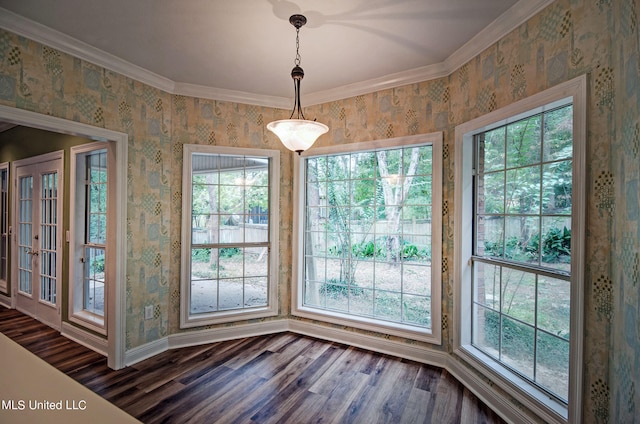 unfurnished dining area featuring ornamental molding, dark hardwood / wood-style floors, and plenty of natural light