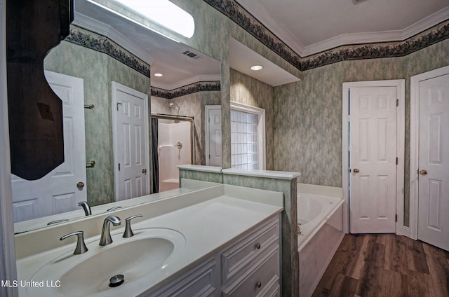 bathroom featuring vanity, ornamental molding, independent shower and bath, and wood-type flooring